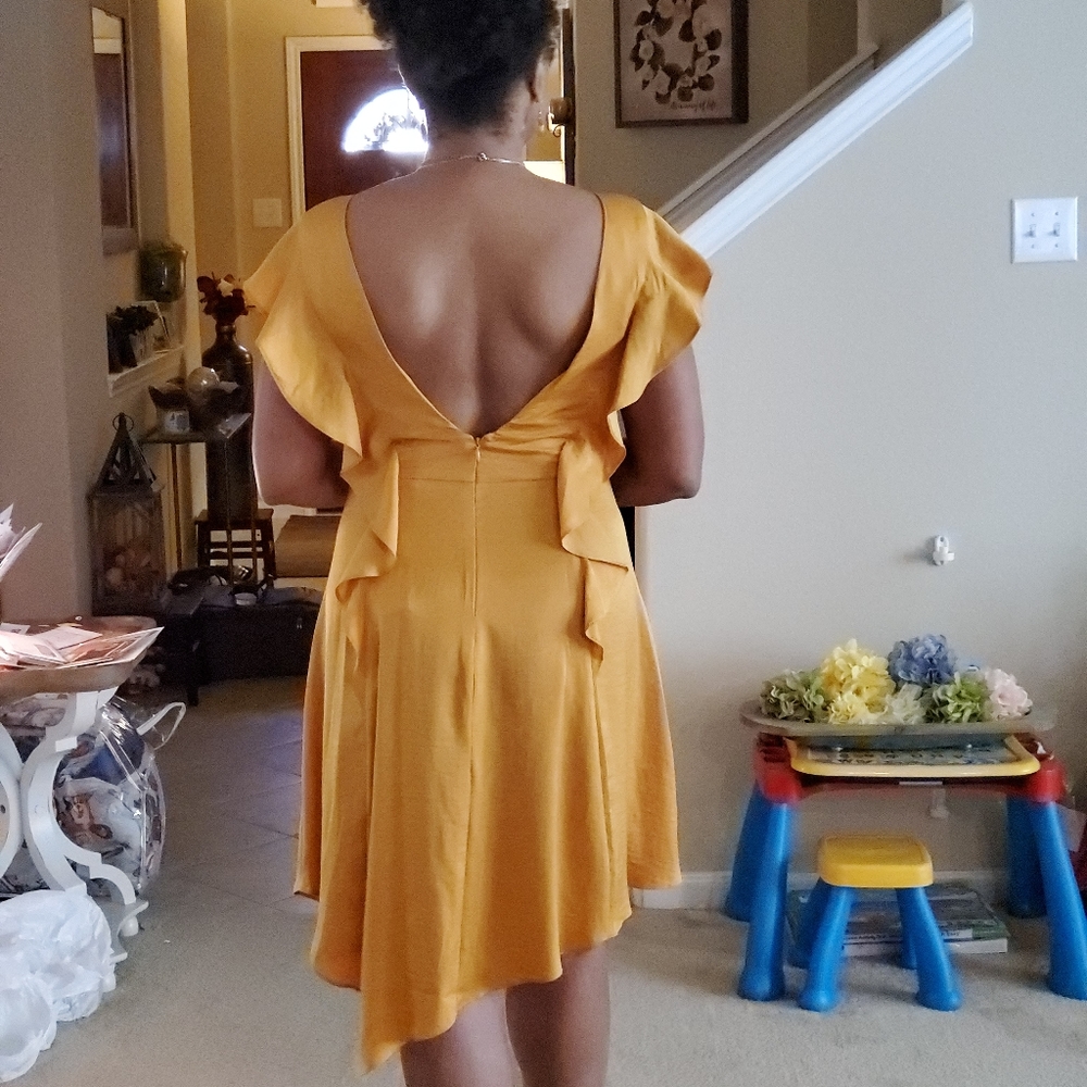 Gold lowback dress.